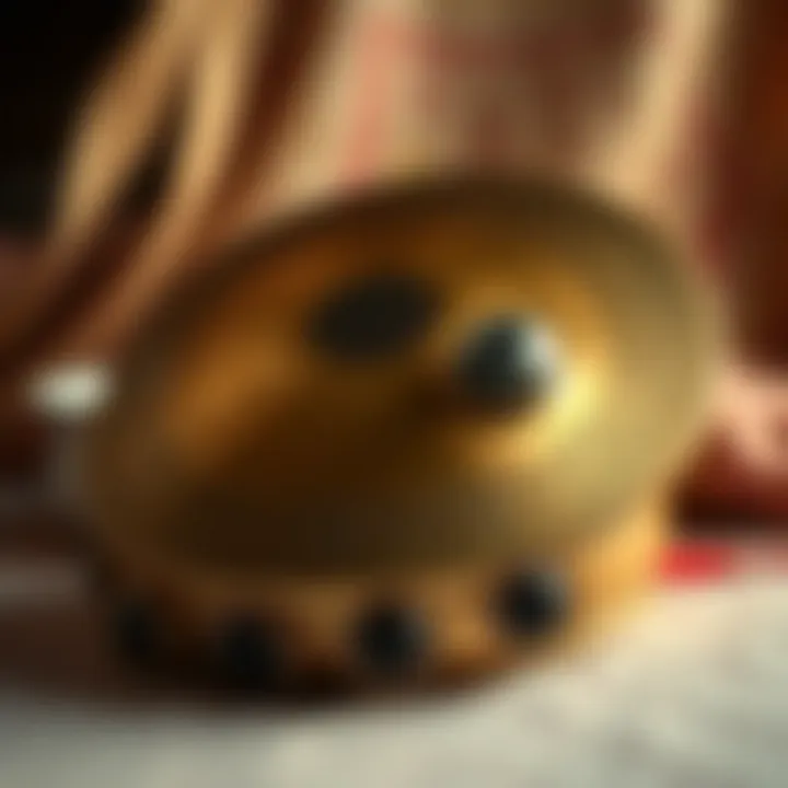 Close-up of a set of finger cymbals, highlighting their intricate craftsmanship and musical role in performances.