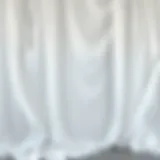 Fluidity of White Draping Fabric Elegant draping showcasing the fluidity of white fabric in a fashion setting