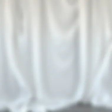 Fluidity of White Draping Fabric Elegant draping showcasing the fluidity of white fabric in a fashion setting