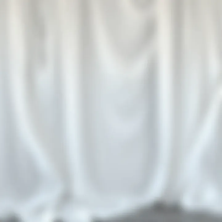 Fluidity of White Draping Fabric Elegant draping showcasing the fluidity of white fabric in a fashion setting