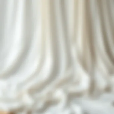 Comparison of White Draping Fabrics Various types of affordable white draping fabrics laid out for comparison