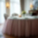 Elegant tulle table skirt draping over a beautifully set dining table