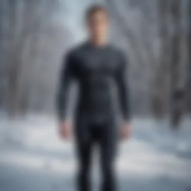 An athlete wearing a long sleeve compression shirt outdoors in a winter landscape.