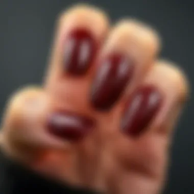 Texture and Shine of Dark Red Nails Close-up of dark red fake nails highlighting texture and shine.