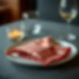 Elegant checkered cloth napkin folded on a dining plate