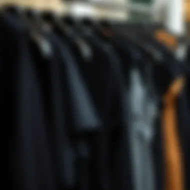 Diverse styles of black knit dresses displayed on hangers
