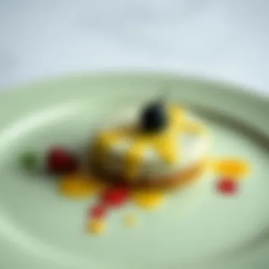 Close-up of delicately plated dessert on a sage green plate