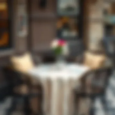 Elegant Round Bistro Table Setup Beautifully arranged round bistro table adorned with elegant tablecloth