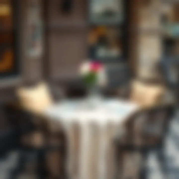 Elegant Round Bistro Table Setup Beautifully arranged round bistro table adorned with elegant tablecloth