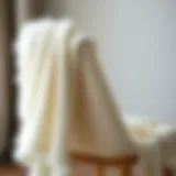Elegant white fuzzy shawl draped over a chair