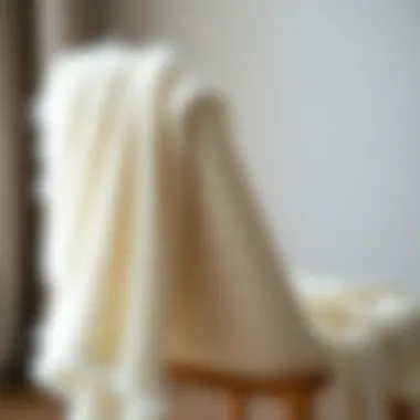 The Elegance of the White Fuzzy Shawl Elegant white fuzzy shawl draped over a chair