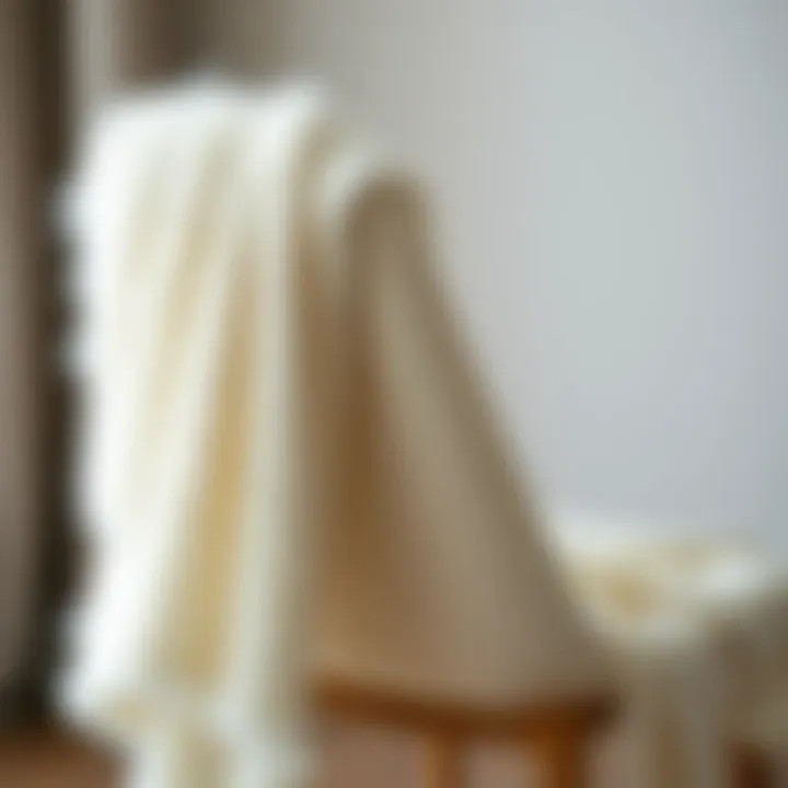 The Elegance of the White Fuzzy Shawl Elegant white fuzzy shawl draped over a chair