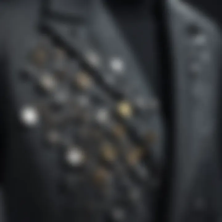 Close-up of a stylish outfit adorned with unique metal pins.