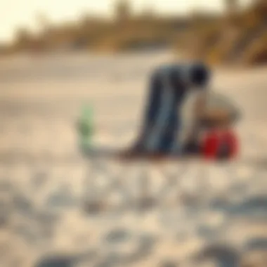 A portable beach backrest chair being set up on sand